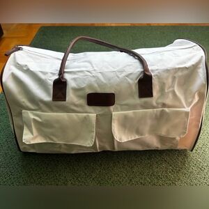 White Duffel Bag with Brown Handles comes with makeup bag